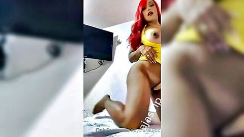 Busty redhead Latina MILF lifting yellow top to flash huge tits and spread legs wide