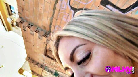 Blonde Latina woman gazing up seductively in stranger encounter thumbnail