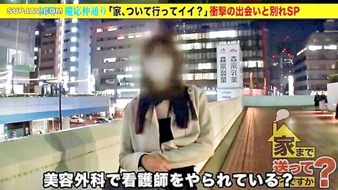 Blurred Japanese amateur woman in coat stands on neon-lit urban street for sudden pickup interview