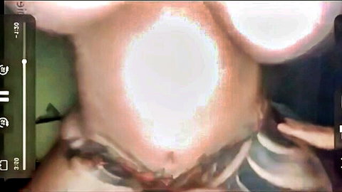 Busty BBW's massive tits and tattooed torso glow in overexposed POV closeup