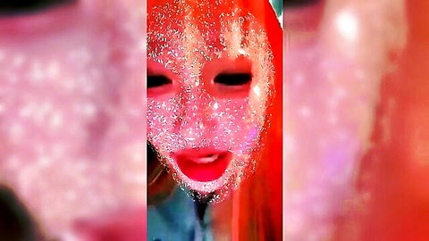 Glitter-covered Japanese girl's ecstatic face with open mouth and sparkling makeup close-up