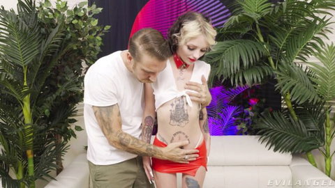 Bryan Gozzling embraces slim tattooed blonde in lifted top and red skirt
