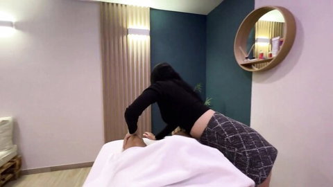 Asian masseuse in skirt bends over for happy ending massage on client