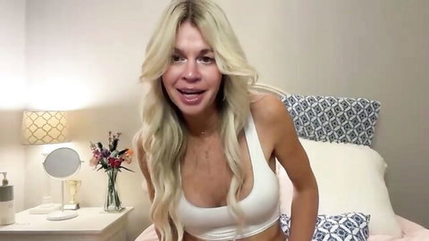 Karabearr blonde curvy model teasing in tight white top on bed