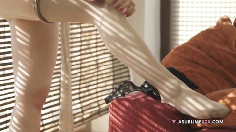 Valentina Nappi seductively adjusts white pantyhose in solo tease