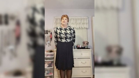 Granny T-Girl Vicki posing seductively in checkered sweater and skirt