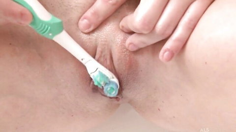 Judy Smile brunette using toothbrush on wet pussy in cum clean fetish