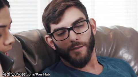 Harmony Wonder close to EboBlack on couch in Reality Junkies teen scene