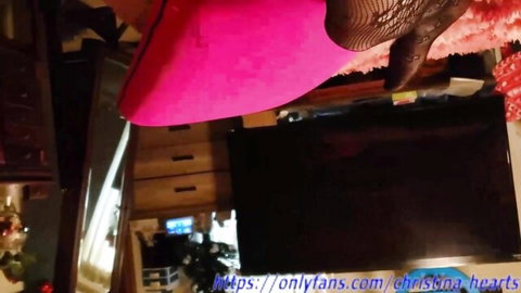 Christina Hearts in pink dress and fishnet stockings, teasing pose