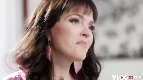 Seductive brunette MILF Krissy Lynn in pink top with teasing gaze