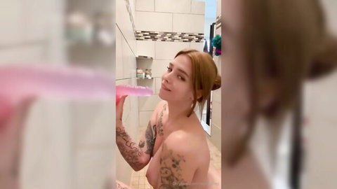 Natalie nude in bathroom, tattooed blonde smiling with toothbrush, large breasts
