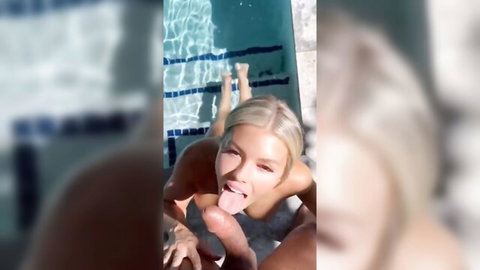 Beautiful blonde babe nude by pool, legs spread in explicit pose