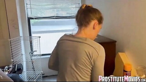Blonde woman in gray top by window in fantasy creampie scene