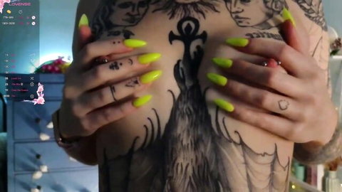 Madalynchaco tattooed beauty teases with neon nails and chest ink