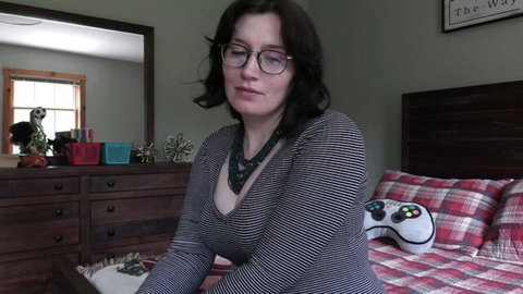 Bettie Bondage in low-cut striped top, glasses, brunette mom roleplay tease