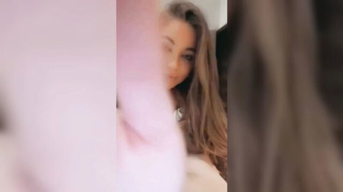 Beautiful blonde teen smiling seductively in pink top after blowjob