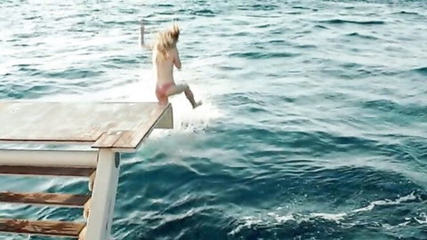 Caterina Shulha topless jumping from boat into sea, nude celeb scene