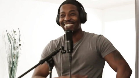 Isiah Maxwell smiling in podcast setup for blind date with Annie King