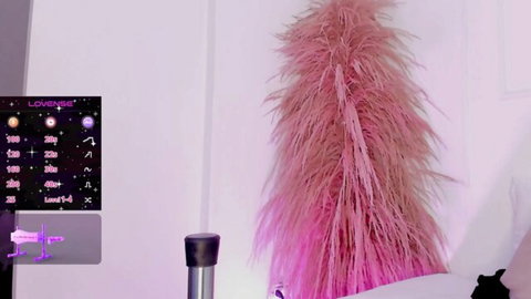 Pink fluffy feathers teasing thick black dildo handle in webcam stream