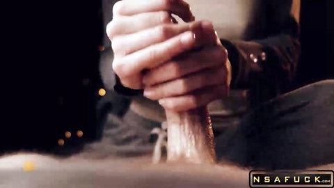Sexy hands gripping and stroking massive erect cock in closeup handjob.