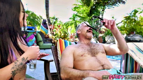 Young brunette in purple bikini teases smiling mature mustached DILF poolside outdoors