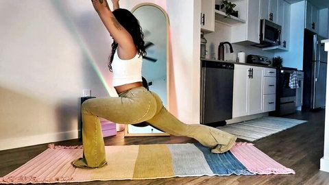 Curvy Black woman in tight yoga pants doing beginner lunge pose
