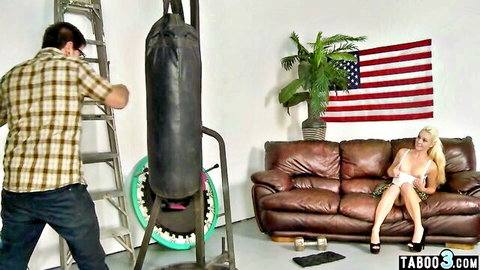 Blonde stepsister watches muscular stepbro's strength on punching bag