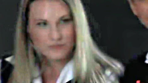 Blonde woman in formal attire for Wired Pussy lesbian bondage scene