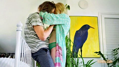 BonnieAlex pregnant blonde in green robe embraced by male partner