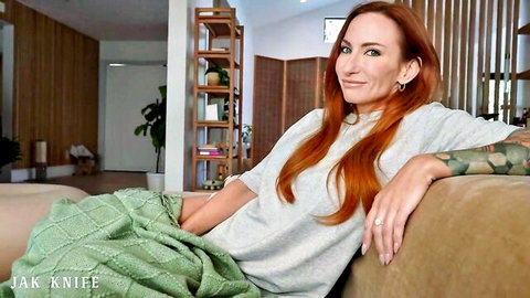 Sophia Locke redhead MILF lounging seductively in sweater and skirt