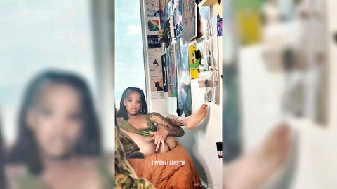 Ebony beauty in green thong spreads legs wide rubbing pussy teasingly