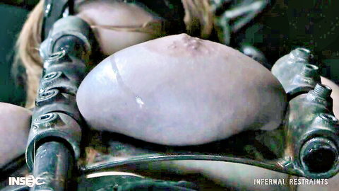 Skylar Snow bound in metal restraints with internal devices, exposed big tits