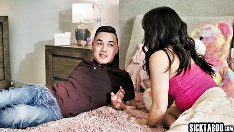 Kimmy Kimm as petite Asian stepsister in pink top chats with stepbro on bed