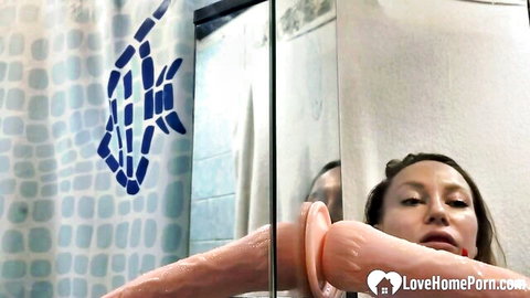 Asian amateur woman posing with large dildo in mirror selfie