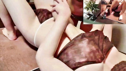 Asian girl lies legs spread wide wearing white thong as hands grip inner thighs teasingly