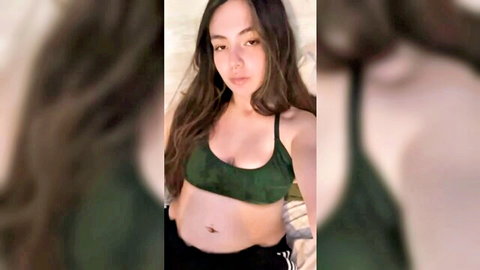 Burping Asian girl in green bralette and black pants, solo amateur tease