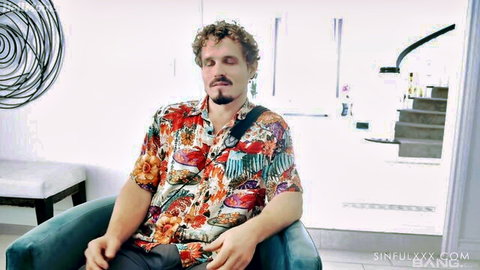 Scarlett Alexis steamy sofa scene with male partner in colorful shirt