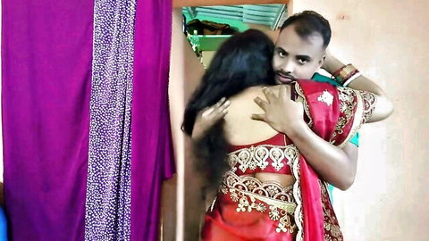 Desi Indian bhabhi in red sari hugged from behind by stepbrother