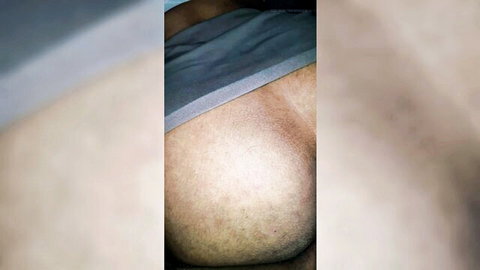 Homemade hotwife's round ass in gray shorts, close-up from behind