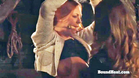 Redhead lesbian bound by ropes, moaning in passion with brunette