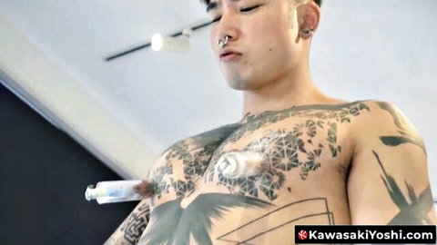Tattooed Japanese hunk Kawasaki Yoshi poses shirtless with chest ink and piercings