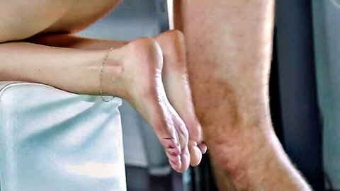 Lexi Luna's bare feet with anklet in close-up seductive pose