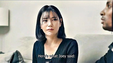 Asian girlfriend in black dress with black guy on couch, interracial tension
