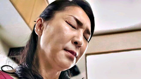 Teary-eyed Japanese MILF in emotional close-up, stepmom taboo vibe
