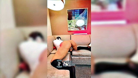 Ebony woman bent over couch in doggy style wearing black stockings with bare ass exposed