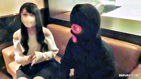Asian stepmom in off-shoulder top and mask with masked man on couch