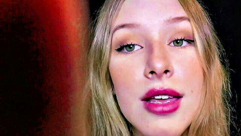 Blonde babe with glossy pink lips parted wide in seductive JOI tease closeup