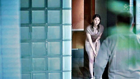 Aika Yumeno lifting gray skirt seductively in JAV scene
