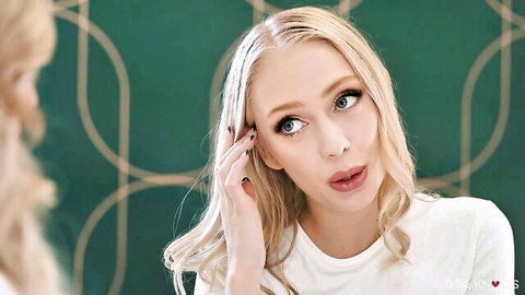 Carmen Valentina blonde beauty in white top with teasing expression