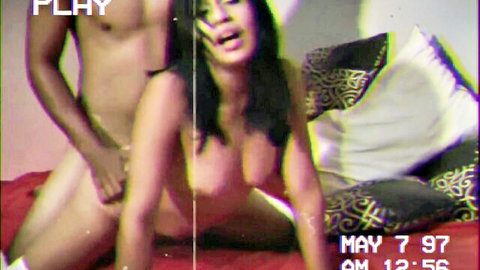 Vintage amateur VHS of nude Asian couple in intimate bedroom sex